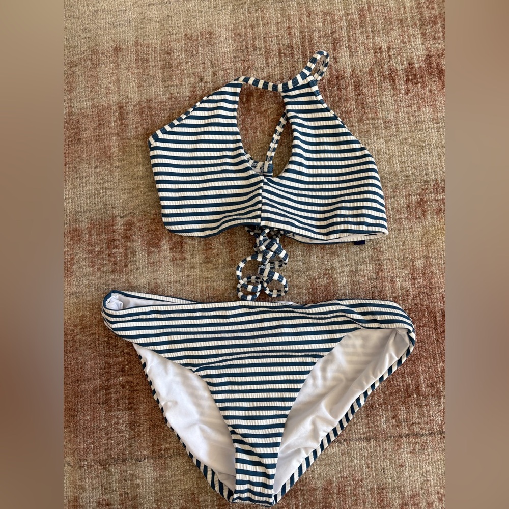 Blue and white kids stripped bathing suit with tie hole in top. in good quality.